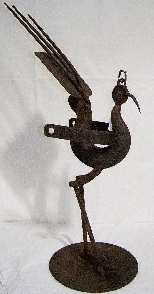 Vintage "Bill Heise" Folk Art Iron Sculpture of Bird: Vintage "Bill Heise" Folk Art Iron Sculpture of Bird/Roadrunner??.Great Folk art sculpture made from found objects.Signed on base.Sculpture is app.28" tall on a round base. K&M Auction does not ship.W