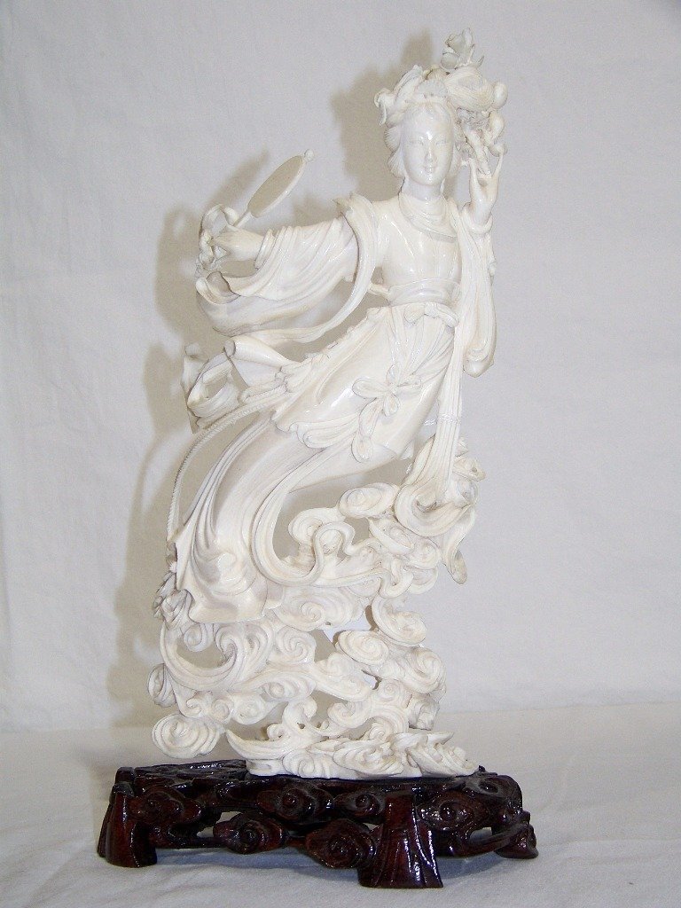 Chinese Ivory Carved Chang'e Flying to the Moon, 11": Early Chinese Ivory Carved Chang'e Flying to the Moon, 11"Great early Chinese Ivory carving of a Chang'e Flying to the Moon with Mirror in one hand on a fabulous cloud base.Figure is app 11" tall and 