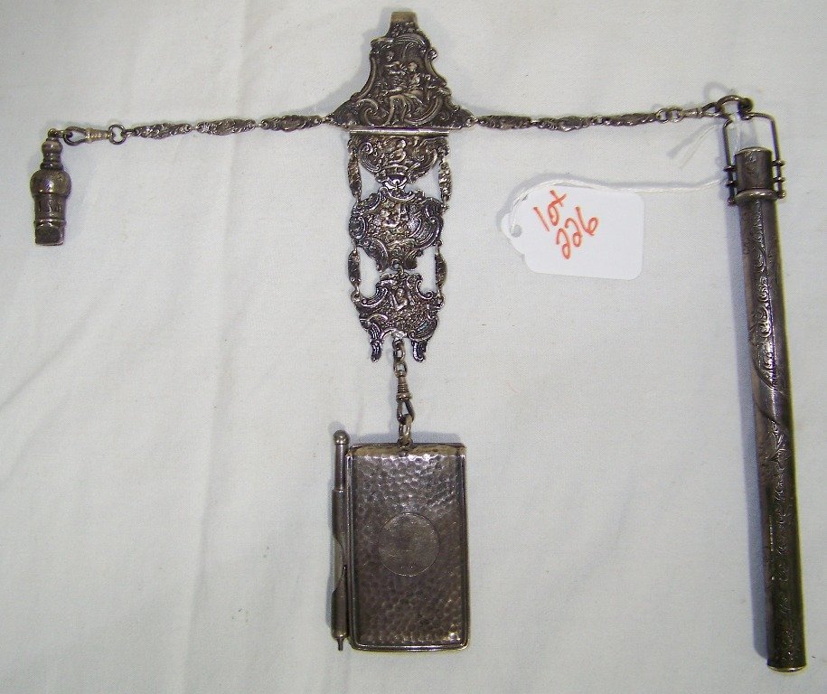 19th C. English Sterling Hallmarked Chatelaine: 19th C. English Sterling Hallmarked Chatelaine a fine pc. with relif figures and scrolling designs.Hangs app.12" long.Weight is 3.51 troy.