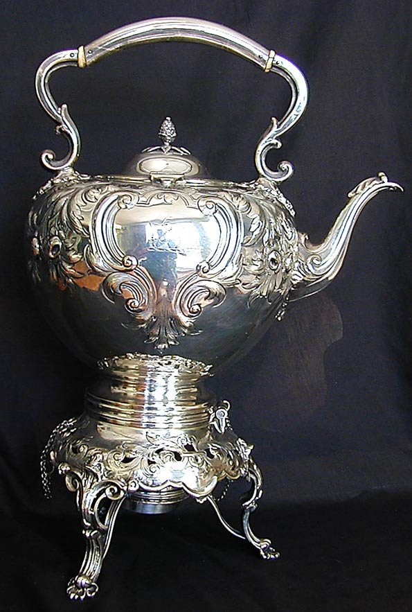 Victorian Silverplate Tea Kettle: This is a Victorian silverplate tea kettle on stand with burner. It is 17 1/2" high