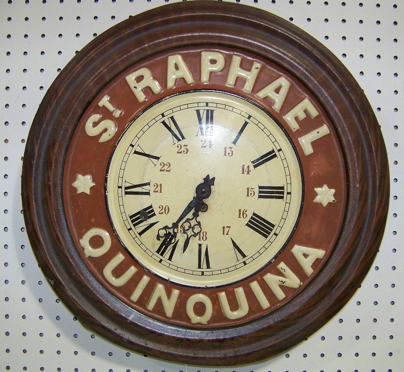 19th C. Tin Tole-ware Clock "St. Raphael Quinquina": 19th C. Tin Tole-ware Clock "St. Raphael Quinquina". Great hand painted tin clock large in size 19" round.