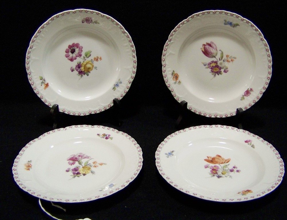 Four 19th C. KPM Neuzierat Hand Painted 7" Plates: Four 19th C. KPM Hand Painted 7" Plates For sale is a set of four plates made by KPM in the early 20th century. They are hand painted with a larger flower in the center as well as three smaller flower