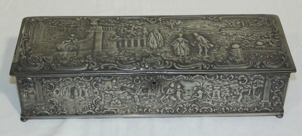 Fine Ornate Wilcox Silver Plate Dresser Box: Fine Ornate Wilcox Silver Plate Dresser Box. Great early S/Plate box by Wilcox silver company.Has courting scenes throughout resting on bun feet.Box is 12 1/2" long,4 1/4" wide and 3 1/4" tall,Has loc