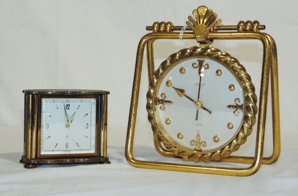 Pair of Early French Alarm Clocks, Looping & Jaz Clocks: Pair of Early French Alarm Clocks. Great pair of clocks.A fine heavy brass/bronze clock by Looping 15 jewels,8 day an a Enameled travel clock by Jaz.Brass/Bronze clock is 7" tall,5 3/4" wide,Jaz is 3"