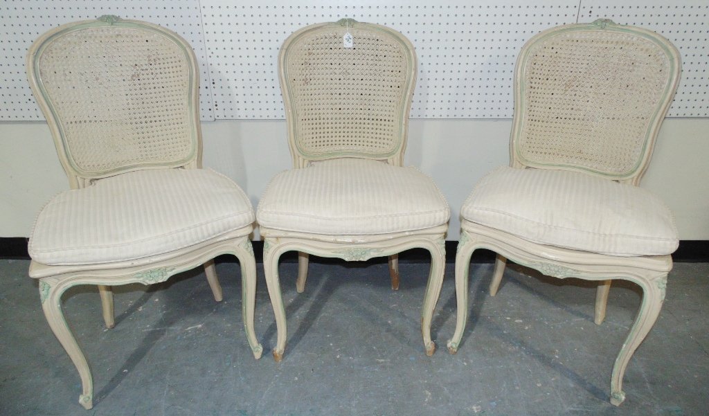 3 Early French Cain Back & Seat Chairs: 3 Early French Cain Back & Seat Chairs.Each with a flower carving on top to each.Each is app.38" tall,20" wide and 20" deep.1 Chair has Cain seat,other 2 have been replaced with material as shown.