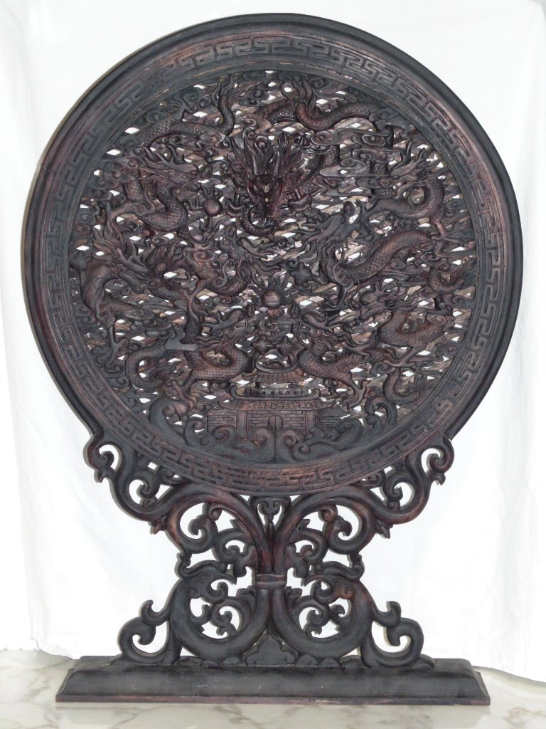 Antique Chinese Wood Carved 9 Dragon Table Screen: Antique Chinese Wood Carved 9 Dragon Table Screen 41" tall.Great fine carved Chinese Screen with 9 carved Dragons to center field all chasing the flaming Pearl.Main Dragon to center is coming out of s