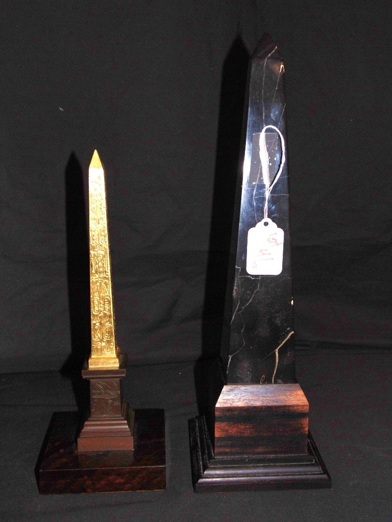 Pair 19th C. Marble Obelisk: Pair 19th C. Marble Obelisk. Great pair with larger one being app.14" tall resting in a rosewood base, other is a gilt bronze Obelisk with a bronze base, resting on a rosewood base.10 1/2" tall on bas