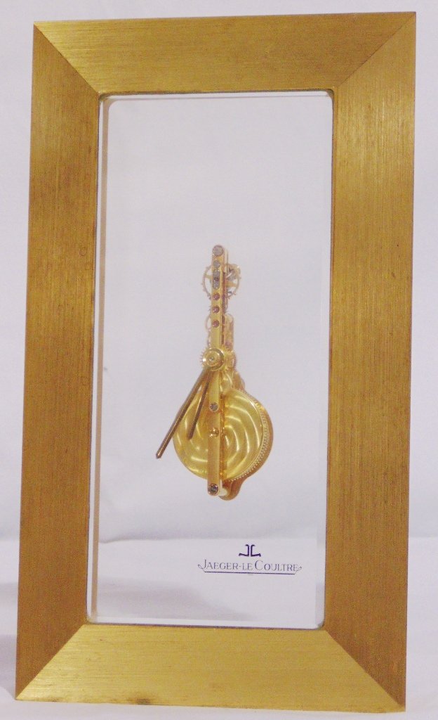 Vintage Jaeger LeCoultre Jeweled Desk Clock: Vintage Jaeger LeCoultre Jeweled Desk Clock. Great clock standing app.8 1/4" tall,4 3/4" wide and app.3" deep.Case is of brass with beveled sides. From the Adams Palm Beach Estate.