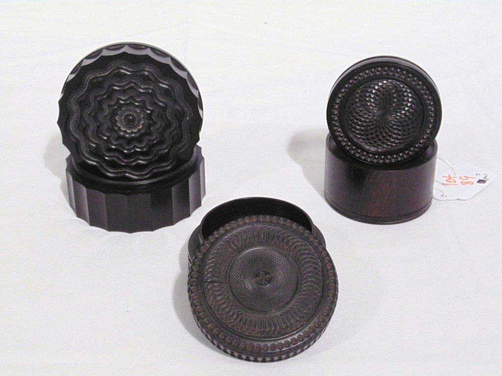 3 Wood Turned 19th C. Snuff Boxes: 3 Wood Turned 19th C. Snuff Boxes.Great set of three with one being 1 3/4" tall and 2 3/8" across, other is 1 5/8" tall and 3" across, last one is 2 3/4" across and 1 1/4" tall (has age split as shown