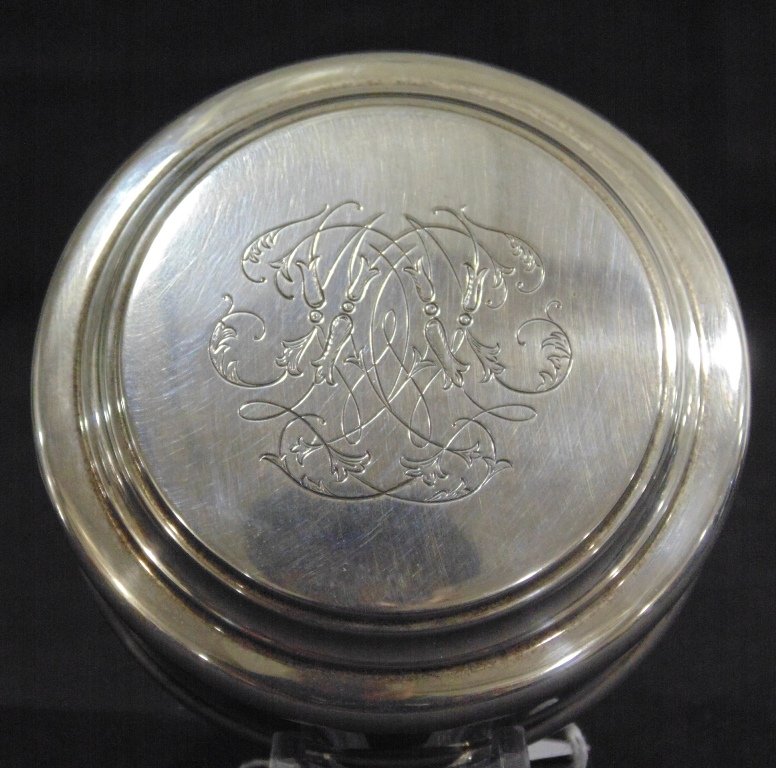 A Fine Asprey of London Sterling Presentation Box: A Fine Asprey of London Sterling Presentation Box. A fine vintage sterling presentation or snuff box,Round in shape and is 3 3/8" across.Weight is 5.70 troy.Engraved on top. From the Estate of Neil Le