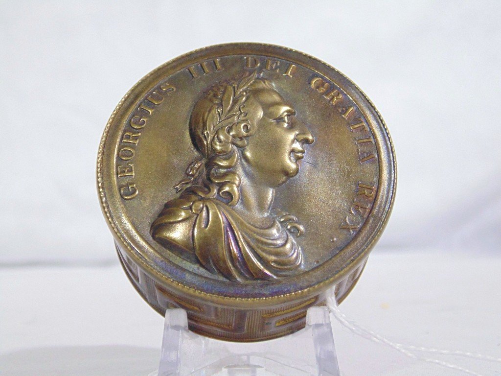 Fine 19th C. Brass Georgius III Patch Box: Fine 19th C. Brass Georgius III Patch Box. A fine Patch/Snuff box with raised details of Georgius III Dei Gratia Rex. with a Greek Key design to outer sides.Round in shape and is 2 1/4" across. From t