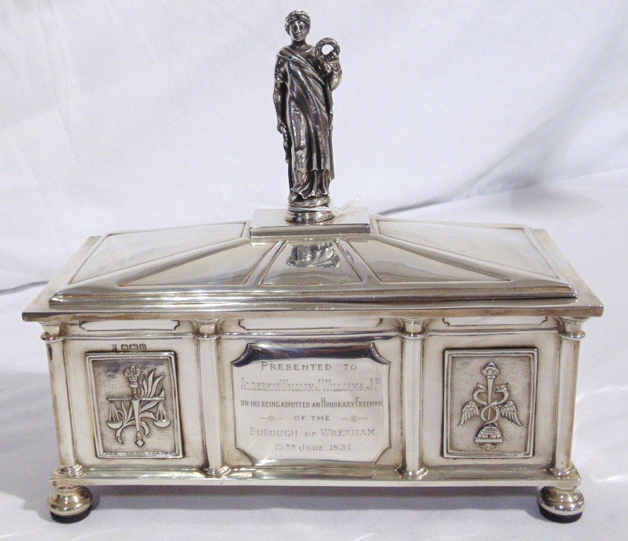 19th C. Sterling Figural Casket by James Deakin & Sons: James Deakin & Sons (John & William F Deakin). A very fine Armorial figural topped sterling Casket/Box by James Deakin & Sons resting on 4 wooden capped feet.Box is 9 1/4" long,4 1/4" wide and 8 3/4" 