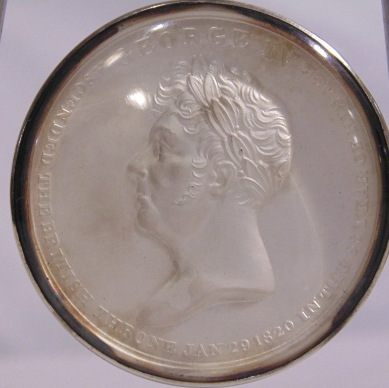 GEORGE IV 1821 CORONATION SILVER MEDAL: This lot is a fine George IV Coronation silver medal. The front inscription reads: George IV, ascended the British throne Jan. 29, 1820 in the 68 year of his age. Back reads: Coranation at Westministe