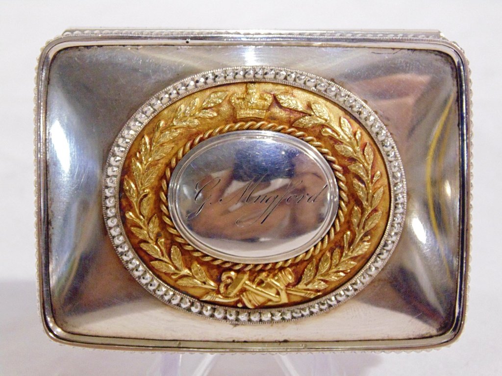 1824 SILVER AND GOLD PRESENTATION BOX: This lot is for a 1824 English silver and gold presentation box. The inscription reads: "Presented by the crew of H. M. ship WINDSOR CASTLE to Mr. Geo. Mugford 1824". The size isd 3" x 2 1/8" x 1 1/4"