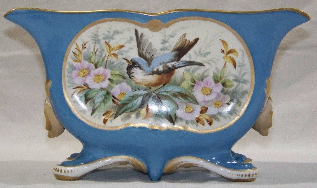 19th C.Old Paris/Sevres Porcelain Hand Painted Planter: 19th C.Old Paris/Sevres Porcelain Hand Painted Planter. Hand painted with Bird & Flower Decorations.Resting on four curved feet and stands app.6 1/4" tall,10 7/8" long and 5 3/4" deep. THIS ITEM BEING