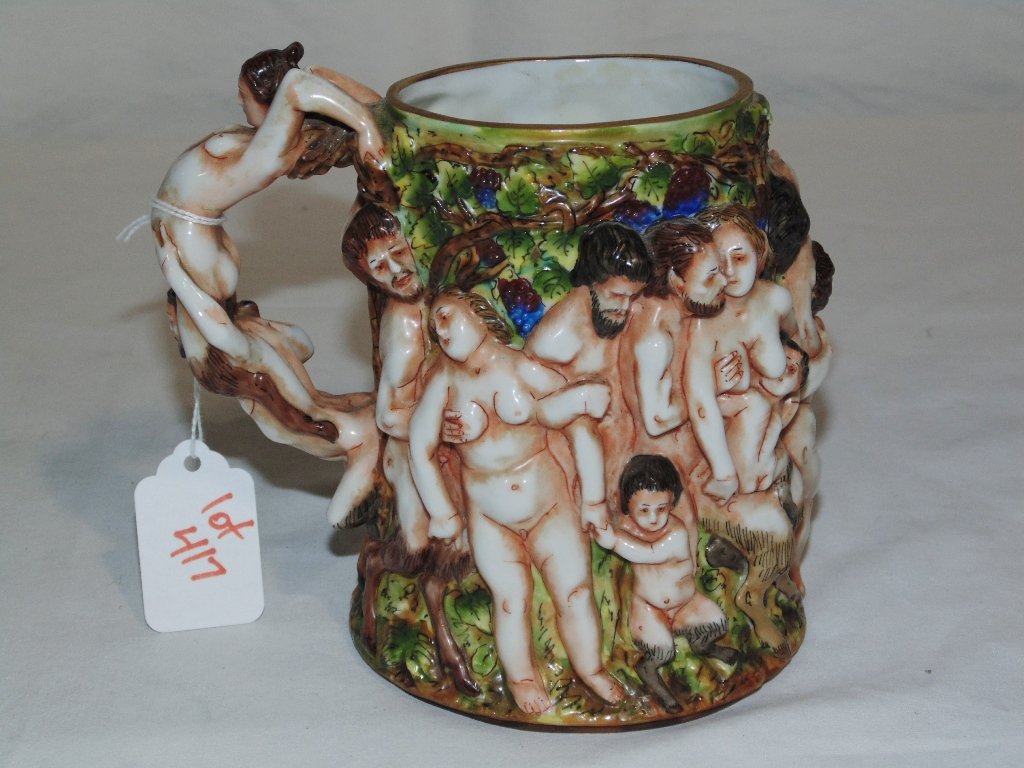 A Fine 19th C. Capodimonte Figural Mug: A Fine 19th C. Capodimonte Figural Mug,a fine hand painted raised decoration mug depicting Bacchic revelry. Height 5 3/4 inches.
