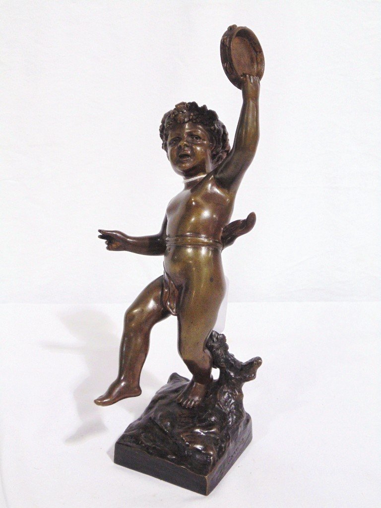 J. Garnier (French 19th C.) Bronze Sculpture of Putti: J. Garnier (French 19th C.) Bronze Sculpture of Young Putti with a Tambourine in his hand.Signed on side and is app.10 1/4" tall. From the Estate of Neil Letson.