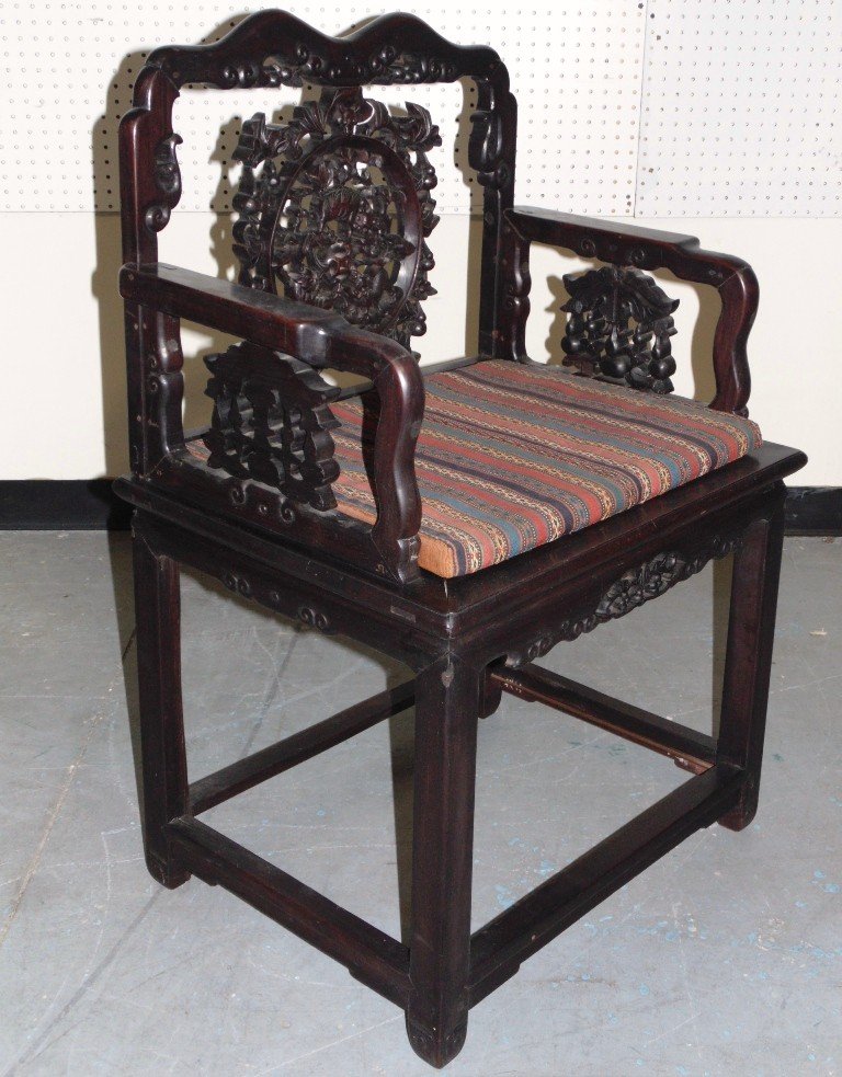 19th C. CHINESE ROSEWOOD THRONE CHAIR: This lot is for a finely carved 19th C. Chinese rosewood throne chair. The back has a large finely carved medallion depicting 3 Foo Dogs frolicking. It is 38" high x 25" wide x 18" deep. Provenance: T