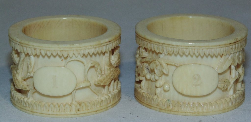 PR. OLD CHINESE IVORY NAPKIN RINGS: This lot is for a pair of old Chinese ivory napkin rings. Each napkin ring has a floral and bird motif. Each is 1 3/4" diameter and 1 1/2" high. Provenance: The Estate of Neil Letson