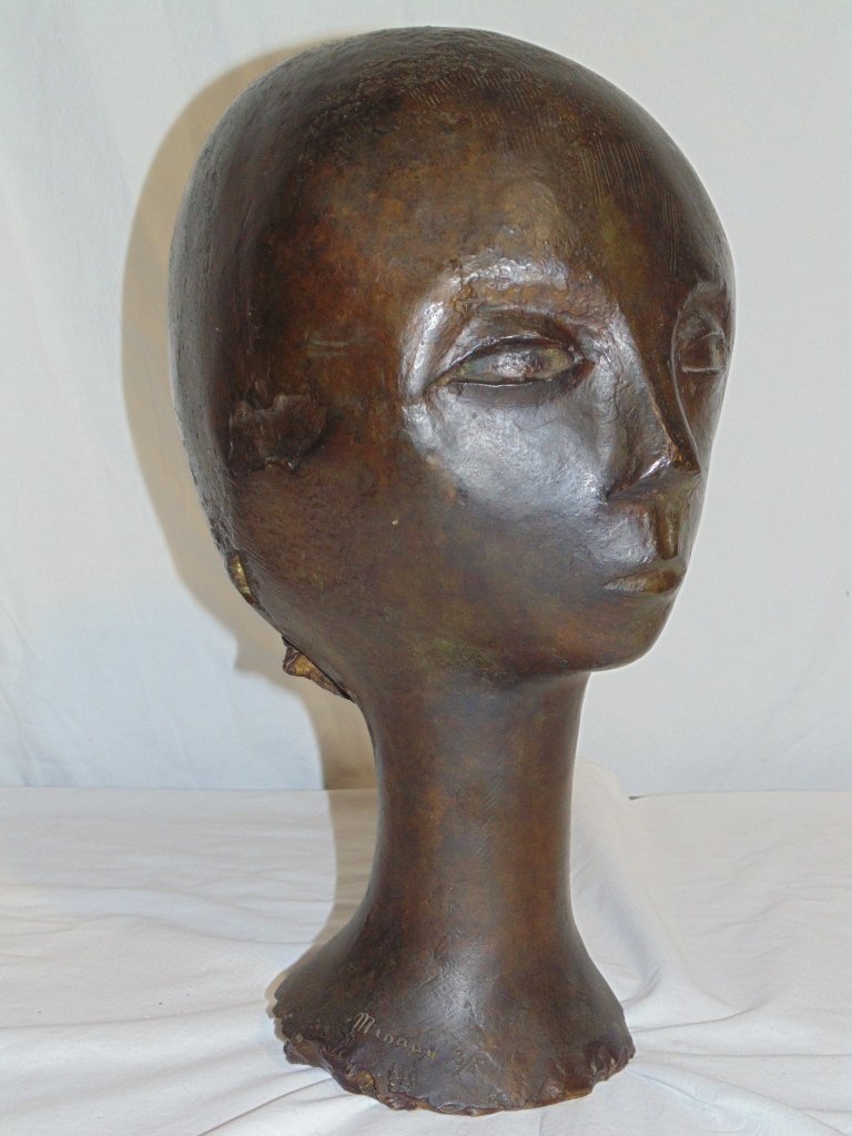 ANDRE MINAUX (Fr. 1923-1986) BRONZE HEAD 16 1/2" High: This lot is for a bronze sculpture by French artist Andre Minaux (1923 - 1986)of a woman's head. The size is 16 1/2" high x 11" wide. It is numbered 3/4 and has a Susse, Paris foundry mark.