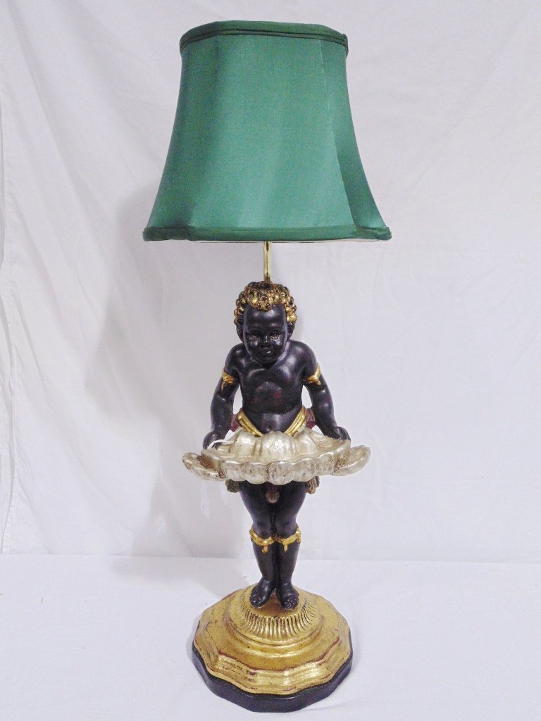 VINTAGE BLACKAMOOR TABLE LAMP: VINTAGE BLACKAMOOR TABLE LAMP.Great table lamp with Blackamoor holding tray and standing 19" tall with a fine green silk shade. Overall height is 29" app.