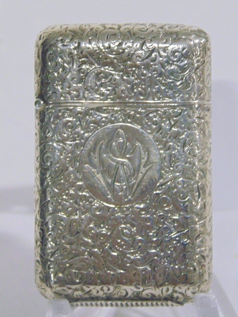 A FINE 19Th C. SAMPSON MORDAN II SILVER MATCH SAFE: A FINE 19Th C. SAMPSON MORDAN II SILVER MATCH SAFE. A fine match safe with ornate decorations throughout case.Hallmarked for Sampson Mordan II, Center has monogramm.Safe is 2" tall, From the Estate of