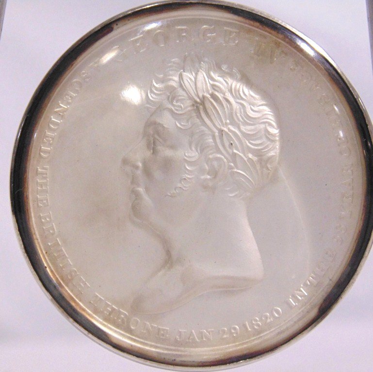 GEORGE IV 1821 CORONATION SILVER MEDAL: This lot is a fine George IV Coronation silver medal. The front inscription reads: George IV, ascended the British throne Jan. 29, 1820 in the 68 year of his age. Back reads: Coranation at Westministe