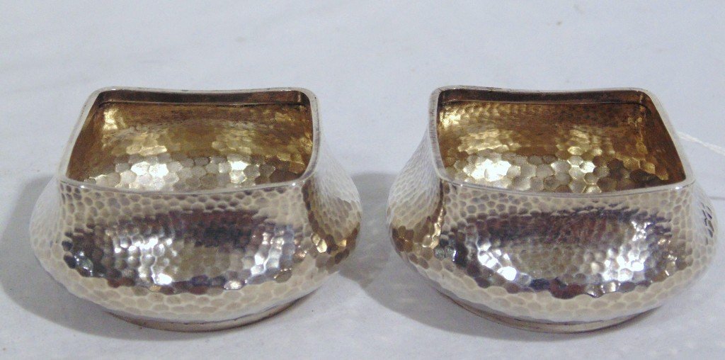 19th C. Theodore Starr Hand Hammered Sterling Salt's: 19th C. Theodore Starr Hand Hammered Sterling Salt's. Great pair of salts with each being 2 1/2" across.Both have Monogram on base.weight is 3.28 troy. From the Estate of Neil Letson.Being re sold for