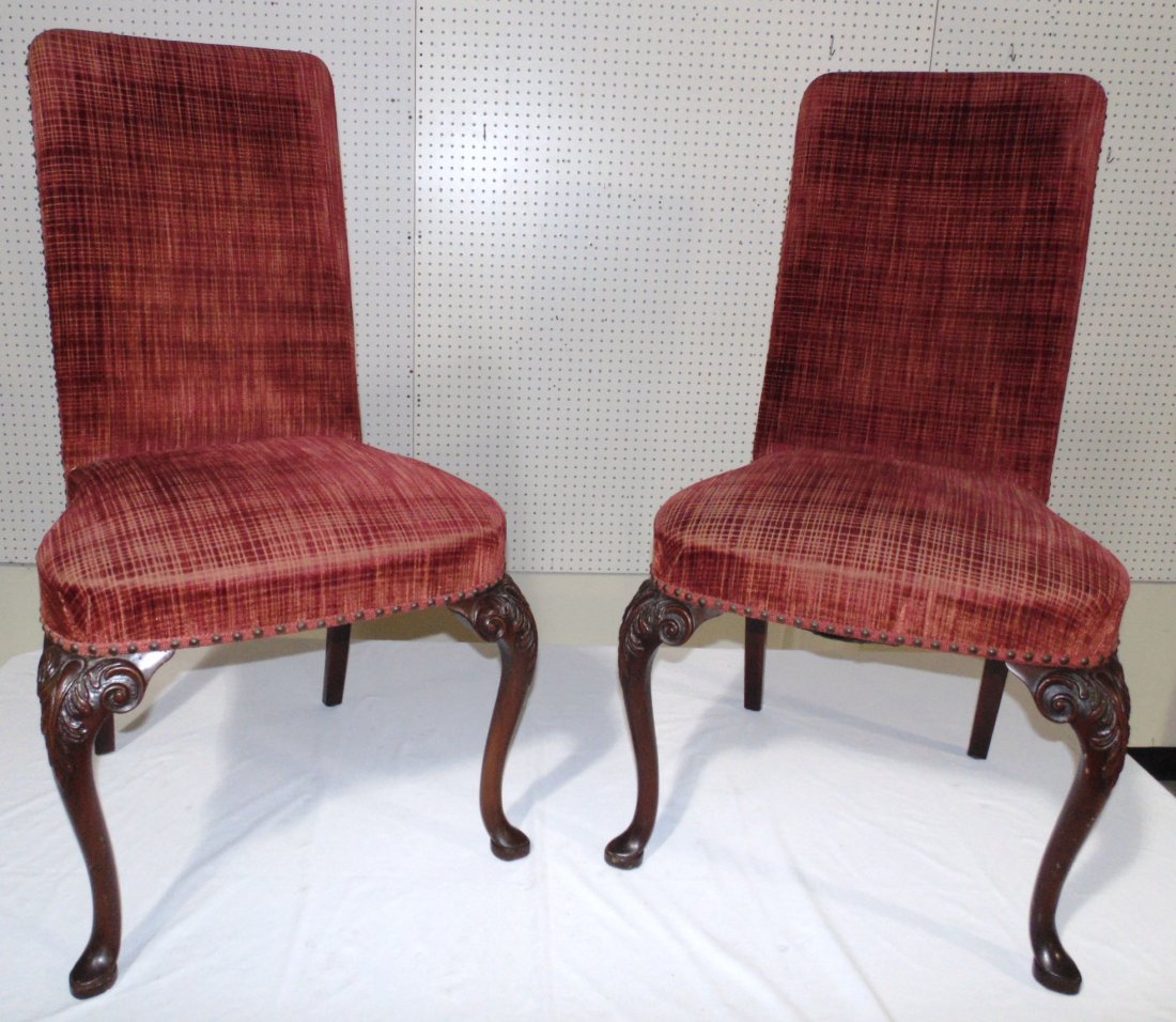 Pair 19th C. Spoon Footed Carved Chairs: Pair 19th C. Spoon Footed Carved Chairs.Front legs to each have fine carving with a red upholstered back with nail heads. Each is app.40" tall,22" wide and 20" deep.From The Estate of Neil Letson.