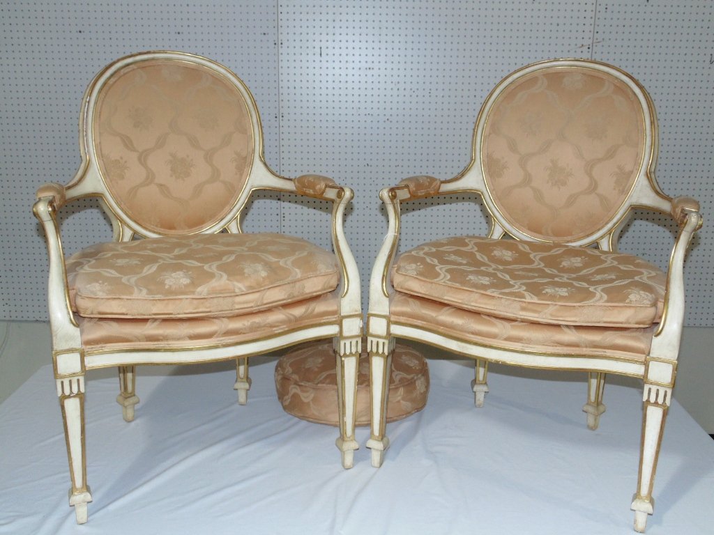 Pair of Early French Gilded Fauteuil's, Floral Silk: Pair of Early French Gilded Fauteuil's, Floral Silk upholstery in a peach color.Each is app.36 1/2" tall,26" wide and 23" deep.Each painted in a cream color with hand painted gold gilt accents. Has on