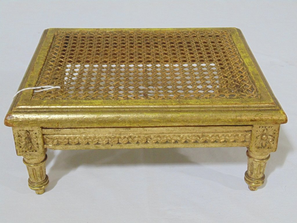 19th C. French Gilt Cane Top Foot Stool/Low Table: 19th C. French Gilt Cane Top Foot Stool/Low Table.Great pc. with a fine gilt throughout with a Cain top and stands 5 1/2" tall,12 1/2" long and 10" wide.From The Estate of Neil Letson.