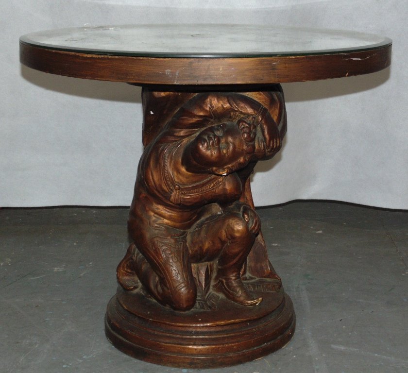Vintage "Blackamoor" Silver Back Mirrored Coffee Table: Vintage "Blackamoor" Silver Back Mirrored Coffee Table. Great table with a silver backed mirrored top (has loss to silver as shown),with a Blackamoor holding top.Stands 20 1/2" tall, 24 1/4" across.