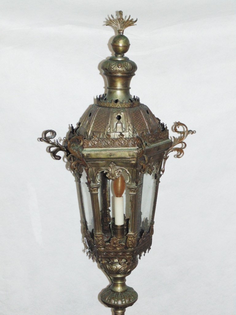 19th C. French Brass Torchier,7'8" Tall: 19th C. French Brass Torchier,7'8" Tall, Great early Torchier with a fine detailed Lantern top, Now electrified and stands 7'8" tall resting on four scrolled Iron feet.App. 19" across feet. Purchased