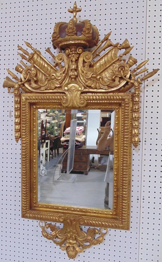 Fine Early Louis XVI Kings Crown Gilt Mirror: Fine Early Louis XVI Kings Crown Gilt Mirror. Great early carved mirror with a large Kings Crown at top with Figure under Crown, with Horns, Spears and other fine carvings.Hangs 48" tall,29" wide.From