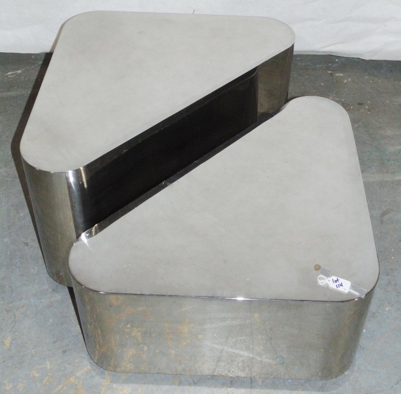 Pair Milo Baughman Chrome Triangular Side Tables: Pair Milo Baughman Chrome Triangular Side Tables.Great pair of tables with one being larger with each having wheels.Each in triangular form with rounded corners, Largest is 30 1/2" long,18 3/4" deep a