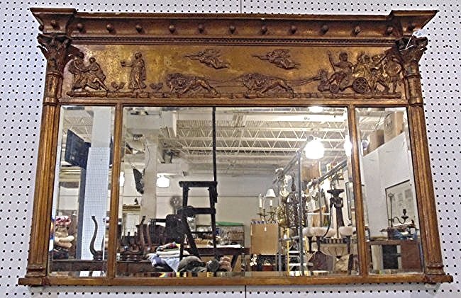 19th C. Ornate Carved Over Mantle Mirror, Lions & Chari: 19th C. Ornate Carved Over Mantle Mirror. With fine carving of Lions pulling a Chariot with Angels fling above. with other fine details. Mirror is 35 1/4" tall, 54 1/4" wide.With three beveled mirror 