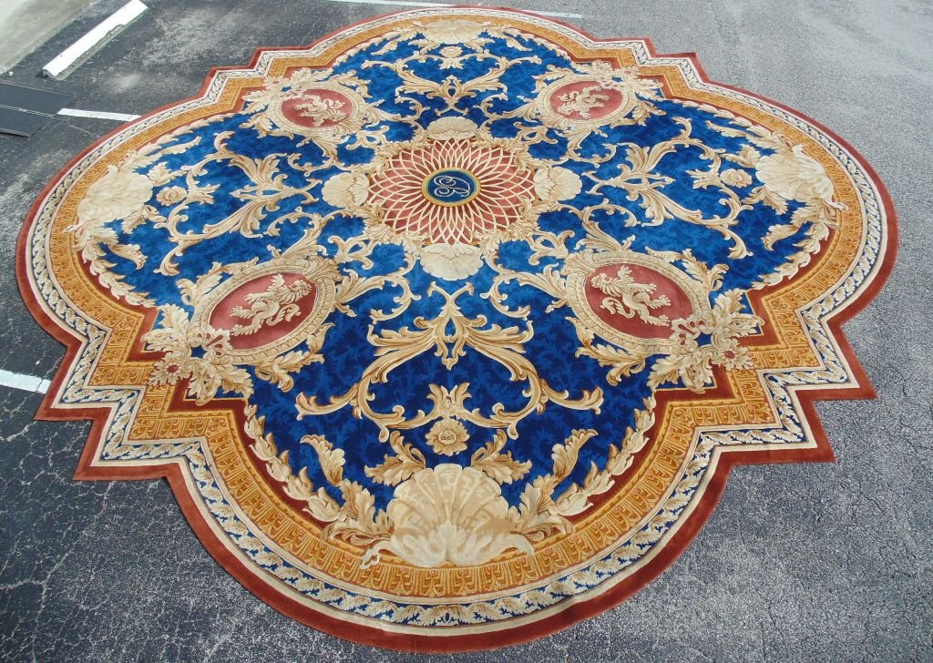 Lg. Super Fine Versace Style Sculptured Rug,23' 10": Lg. Super Fine Versace Style Sculptured Rug,A super fine Sculptured rug with 4 Medallion's with figure of a Lion.with a fine center field.In Blues,Creams.Gold and other fine colors. Size is 23'10" squ