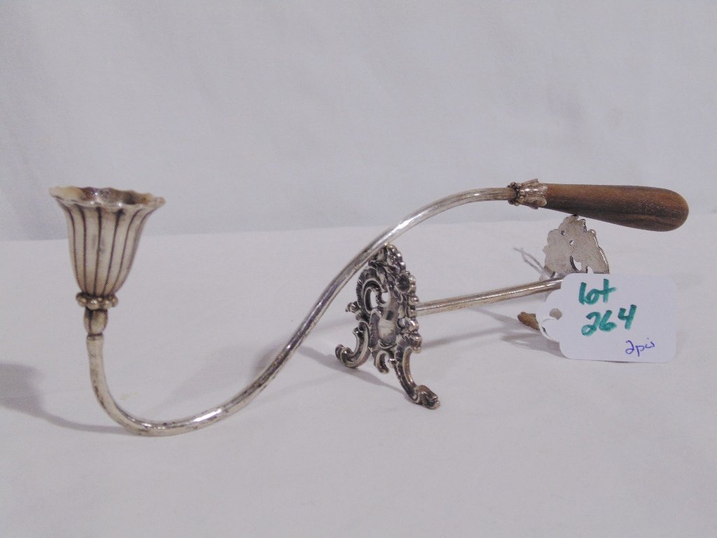 Early Sterling Candle Snuffer & Sterling Knife Rest: Early Sterling Candle Snuffer & Sterling Knife Rest.Fine early candle snuffer in the style of Georg Jensen and is 9 1/4" long with a wooden handle, Marked Sterling.Knife rest is stamped 800 with ornat
