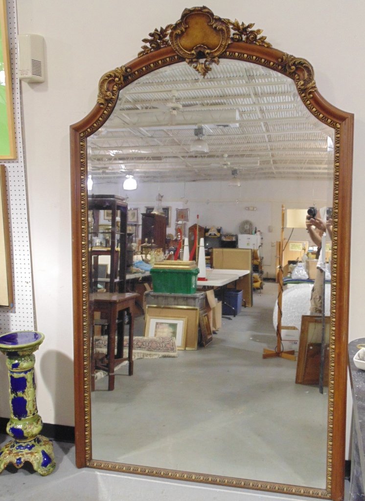 Fine 19th C. Carved Pier Mirror: Fine 19th C. Carved Pier Mirror.Great large mirror with carvings of a Shield and flowers at top with gold gilt highlights. Mirror is app. 7'5" tall,4'6" wide.