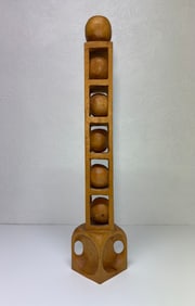 Large hand carved,whittled wooden balls in a cage sculpture. Signed Charles flowers 2003