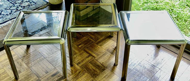 GROUPING OF THREE HOLLYWOOD REGENCY BRASS AND CHROME GLASS SIDE TABLES: Set of Three 1970s brass and chrome side tables, Hollywood Regency style. Designed in the Spirit of designers like Romeo Rega or Willy Rizzo.