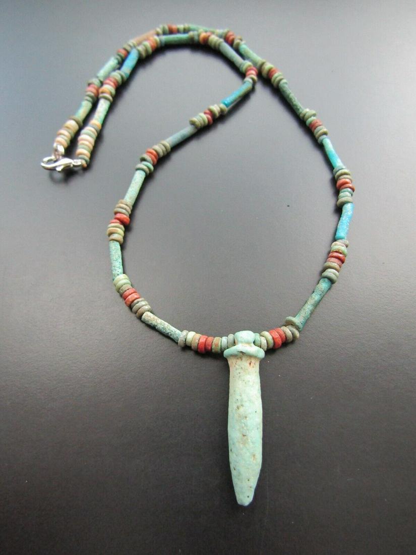 Vintage Retro Artifact Necklace Mummy Beads Amulet: Vintage beads made from mummy beads with an papryrus column amulet. An amulet in the form of a colony, showing strength and endurance. Period: 1000 BC. Ancient beads are completely vintage in the spir