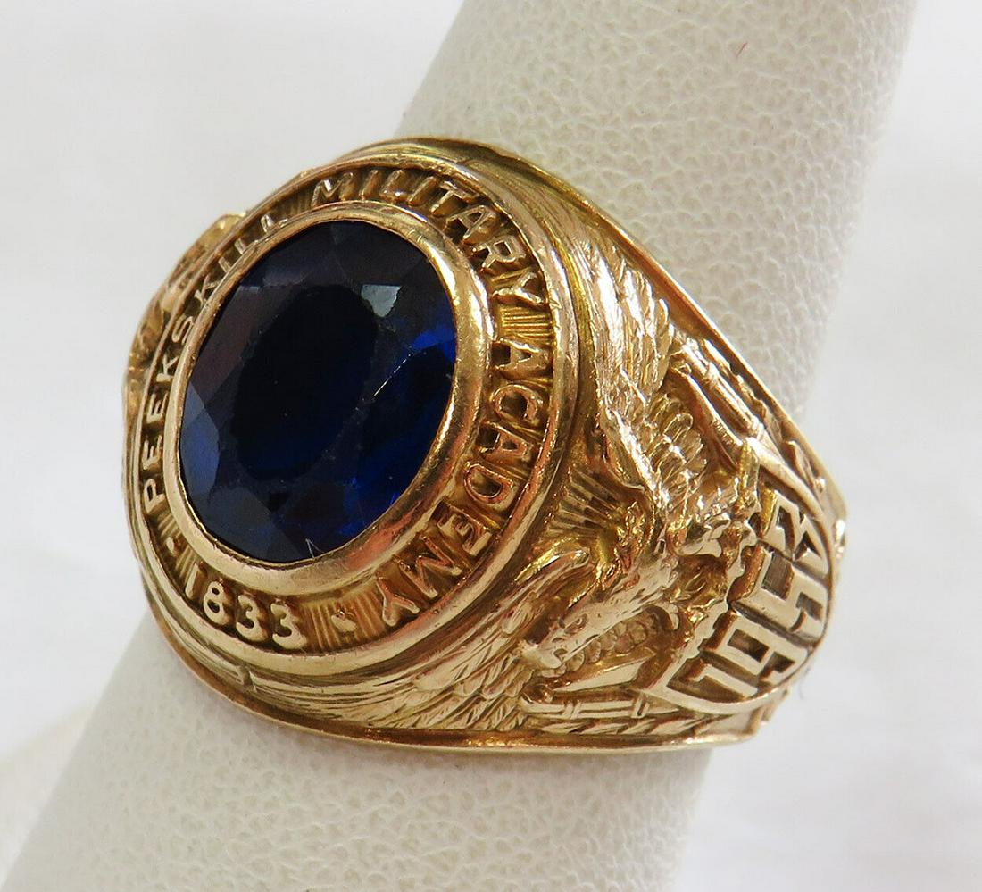 Peekskill military academy ring 10K gold blue stone: This is menâ€™s graduating of Peekskill military academy 1953 ring. This class ring belonged to Edward James Marko. This class ring is with a faceted blue synthetic stone inset into the crown (ch