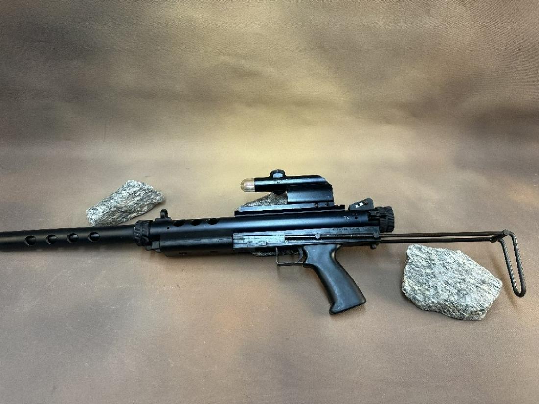 Feather Industries AT 9 9 MM LUGER Rifle: Feather Industries AT-9 is a semi-automatic rifle that is chambered in 9mm Luger. It is designed to use Glock-compatible magazines and features a blowback operating system. Equipped with a Weaver Qwik