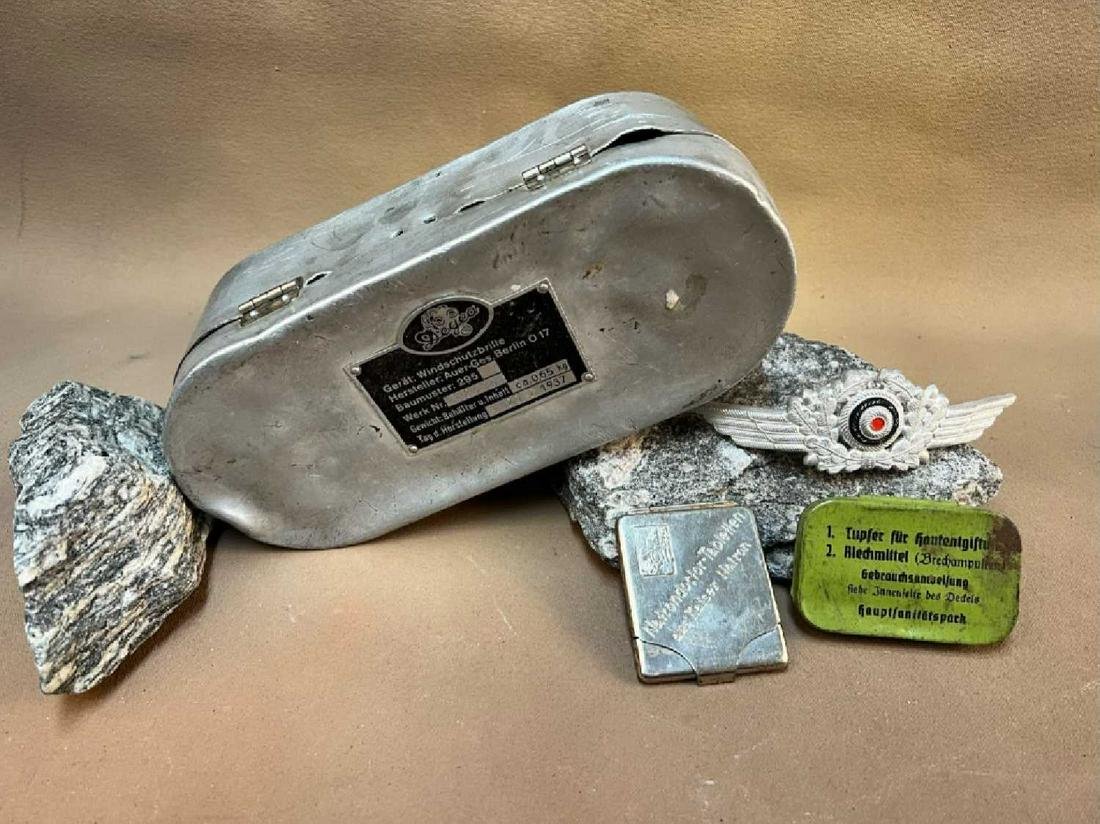 German WWII: German WWII goggle box with Luftwaffe Visor Cap Wreath and first aid supplies. See photos.