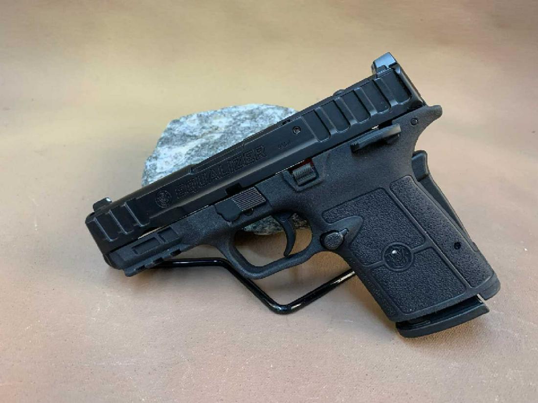 Smith & Wesson Equalizer 9MM Luger: The "Smith & Wesson EQUALIZER 9mm Luger" is a 9mm Luger caliber semi-automatic pistol produced by Smith & Wesson. In the original box w/lock, appears to have never been fired.SN: PJD6319