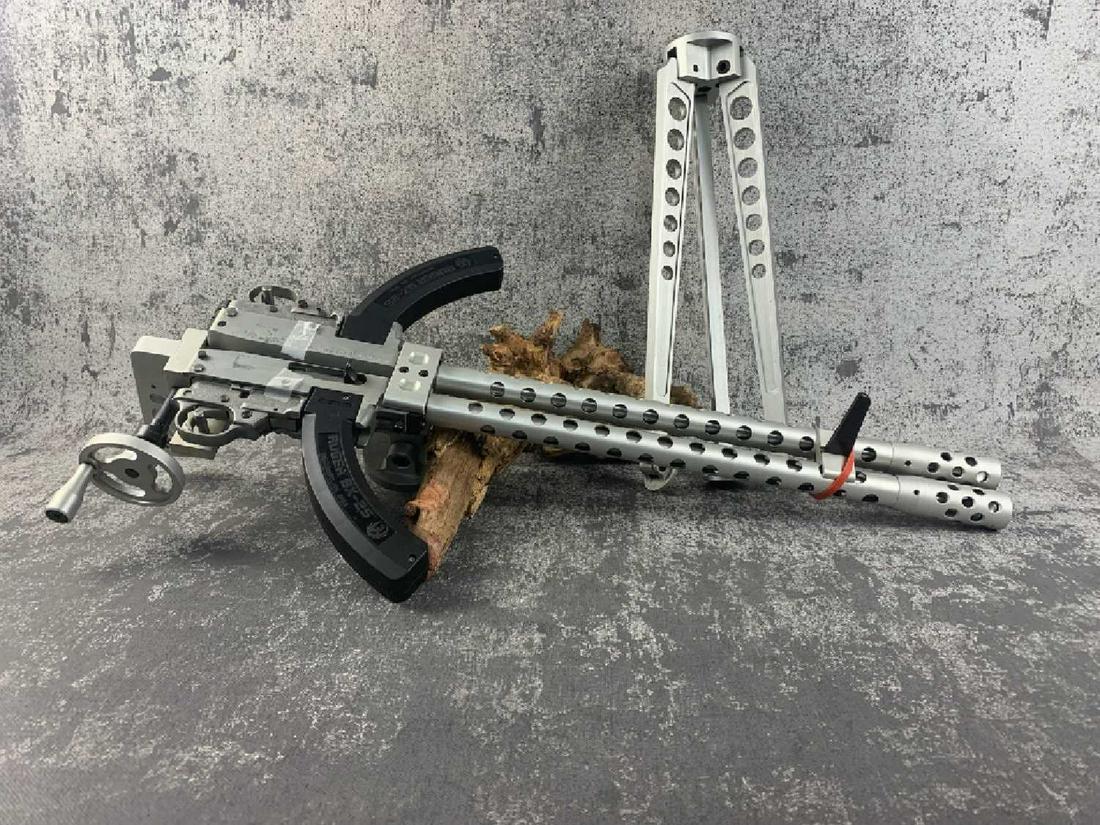 Twin Ruger 10/22 Carbines Paired w/Tripod: Oh Yeah! What fun! On the block is a paired rifle offered by Ruger in .22LR, this weapon boasts twin BX 25 Clips and sits atop an aluminum tripod. The weapon is in very, very nice condition and would 