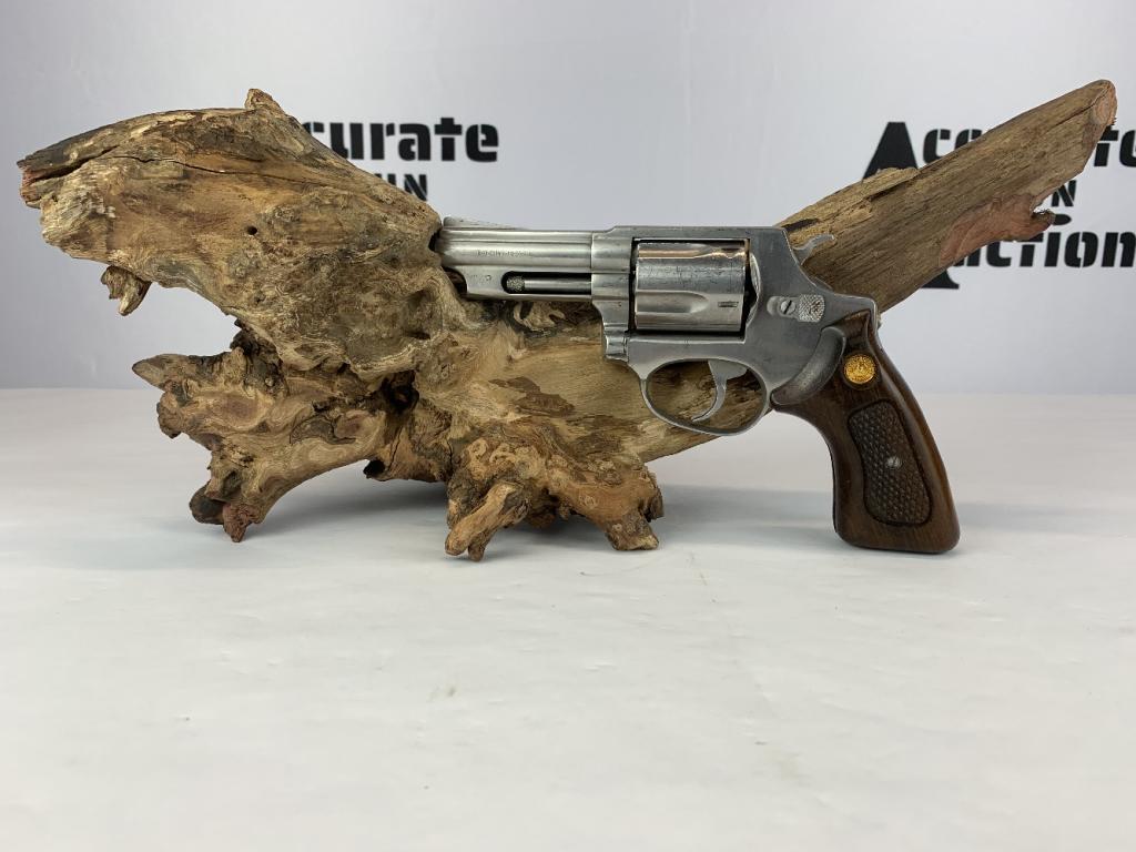 Taurus 85 .38SPL: This Taurus Model 85 is a small frame double action revolver chambered in .38 Special. Wearing wood grips with gold Taurus medallions inlayed and a ramp front sight, this firearm is easy to fire and i