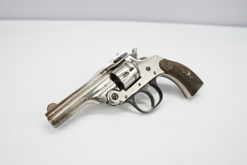 Hopkins & Allen Saftey Police .32 S&W: This Hopkins & Allen is chambered in 32 and features 3 inch solid rib barrel with visible markings and shows some wear. Hard plastic checkered grips with the H & A motif on each side. The revolver fea