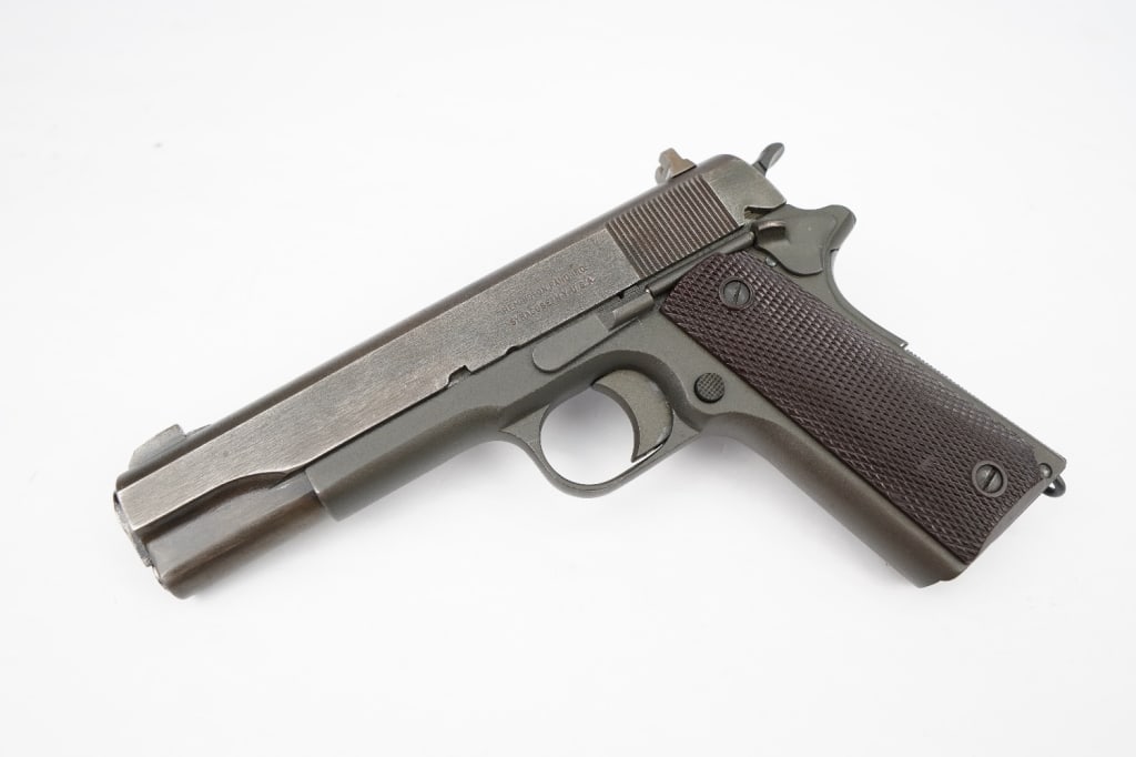 Colt 1911 M 45 ACP: This is a unique build on a Colt 1918 WWI era lower and a Remington Rand WWII era Slide. The pistol is chambered in .45 ACP with Springfield National match barrel. Remington Rand was awarded its first